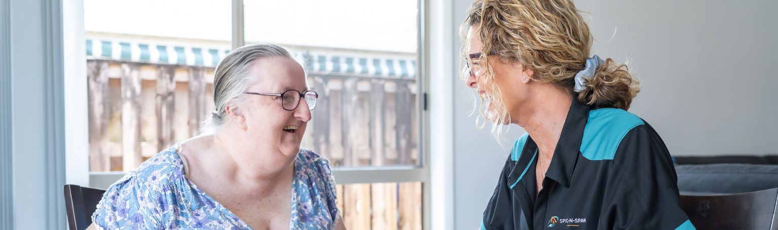 Participant chatting with a Spic N Span support worker at home
